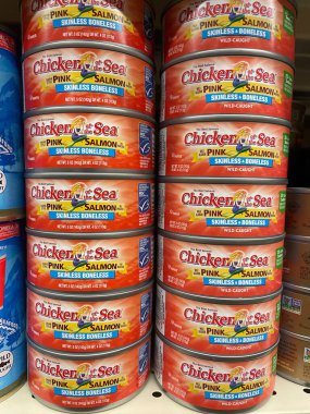 Grovetown, Ga USA - 01 02 23: Grocery store Chicken can skinless salmon close up stacked