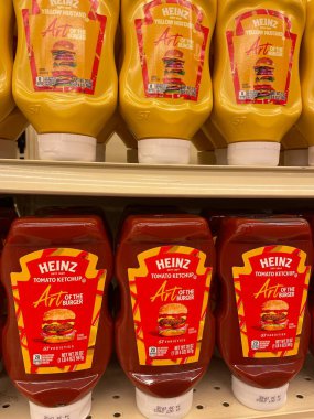 Grovetown, Ga USA - 01 02 23: Grocery store Heinz Ketchup and mustard on shelves