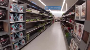Martinez, Ga USA - 01 21 22: Walmart super center interior pan to lawn and garden yard decor partial empty shelves