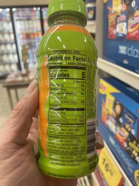 Grovetown, Ga USA - 02 17 23: Grocery store hand holding Gatorade sports drink fast twitch nutrition label
