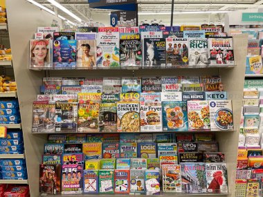 Grovetown, Ga USA - 01 15 23: Grocery store magazine rack various magazines