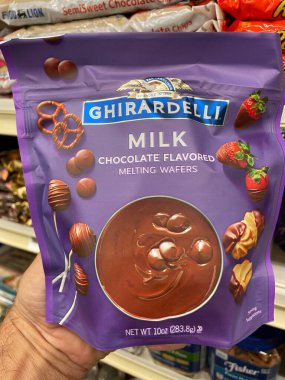 Grovetown, Ga USA - 09 03 22: Grocery store Ghirardelli chocolate hand holding