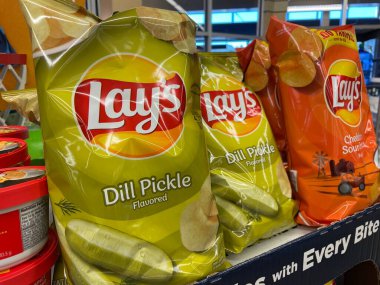 Grovetown, Ga USA - 03 14 23: Grocery store Lays chips dill pickle clipart