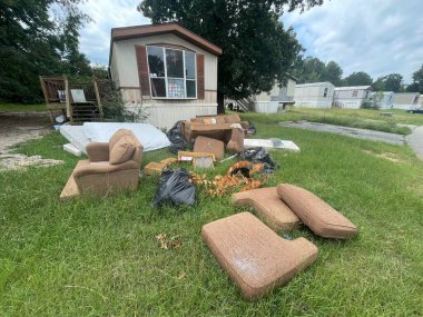 Grovetown, Ga USA - 08 19 23: Trailer park eviction household items put on curb clipart