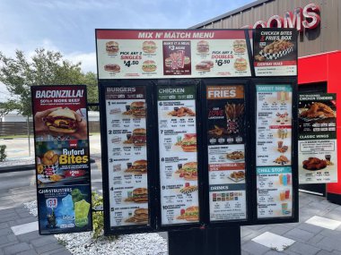 Lakeland Fla, USA - 05 18 24: Checkers fast food drive thru menu close up clipart