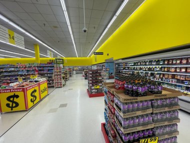 Lakeland Fla, USA - 05 19 24: Harveys grocery store interior looking down back aisle clipart