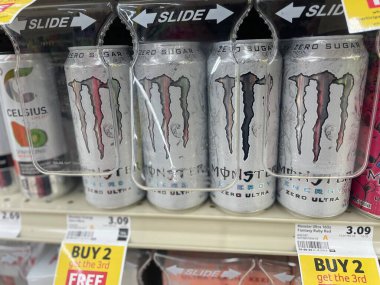 Lakeland Fla, USA - 05 19 24: Harveys grocery store interior Monster energy drink secured clipart