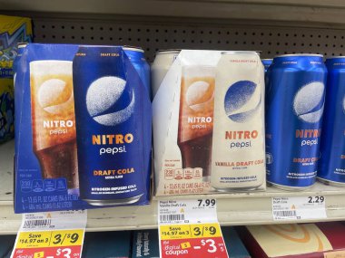 Lakeland Fla, USA - 05 19 24: Harveys grocery store interior Pepsi Nitro energy drink prices clipart