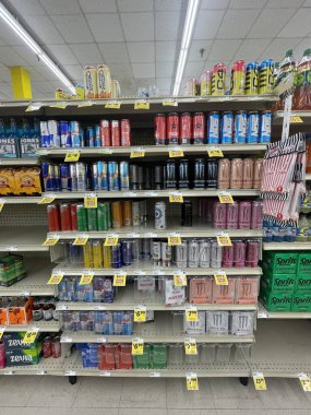 Lakeland Fla, USA - 05 19 24: Harveys grocery store interior energy drink section and prices clipart