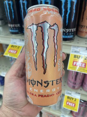 Lakeland Fla, USA - 05 19 24: Harveys grocery store interior Monster energy drink peach clipart