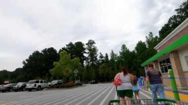 Lilburn, Ga USA - 07 20 20 - Walmart 2020 Covid exterior people wearing face masks clipart