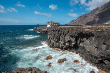 rocky beach with a natural arch in Las Puntas. El Hierro island. Canary Islands