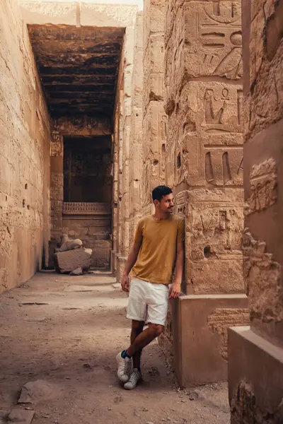 stock image young male traveler visits Karnak temple in Luxor, Egypt