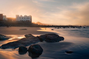 Beautiful seascape at sunset in Quintanilla Beach. Arucas. Gran Canaria. Canary Islands. Spain clipart