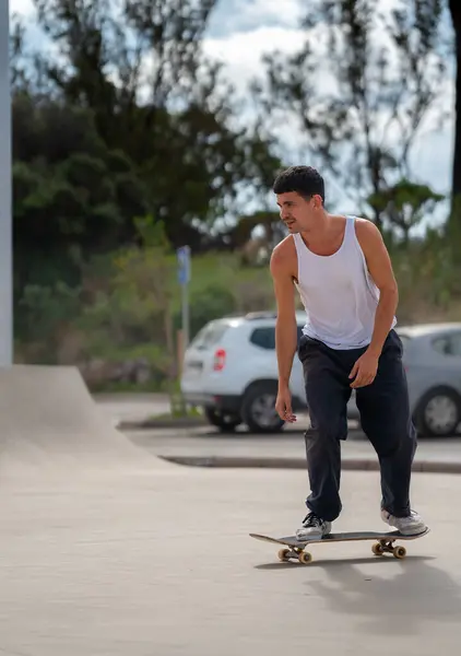 stock image young man skater jumping a ramp in a skate park. 