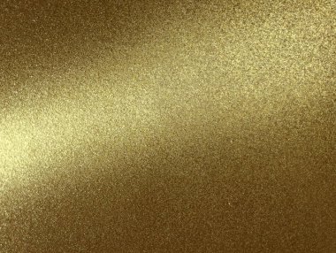 Shiny gold glitter background with grainy texture and highlight