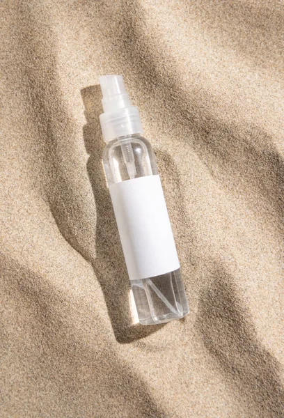 Spray Bottle Blank Label Beige Sand Top View Hard Light — Stock Photo, Image