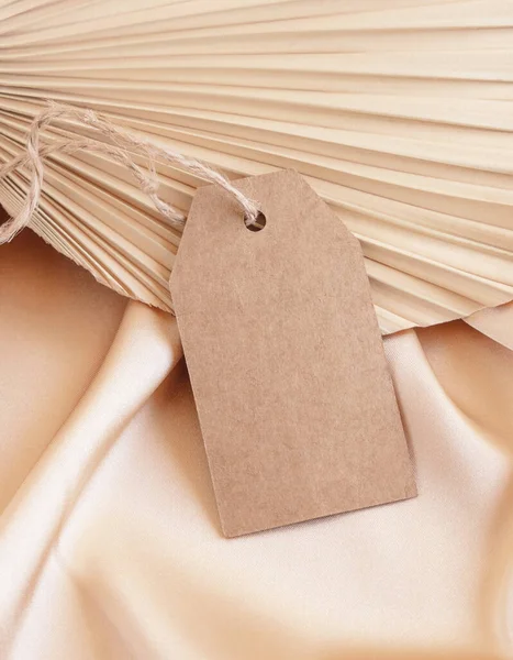 Blank Gift Tag Beige Satin Fabric Dried Palm Leaf Close — Stock Photo, Image