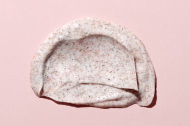 Açık pembe üst manzaralı kozmetik ovalama lekesi. Cilt ürünü dokusu - krem ya da besleyici merhem. Nemlendirici yüz kremi ya da vücut losyonu lekesi. Günlük kişisel bakım