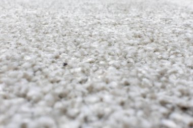 Tarafsız gri halı ya da halı. Düşük açıdan çekilmiş. Tilt-shift yakın-kaplama halı