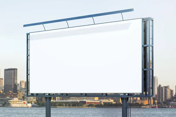 Blank white horizontal billboard on city buildings background at daytime, perspective view. Mockup, advertising concept