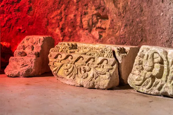 Beautifully carved stone architectural pieces inside the museum cave at Bet She`arim National Park in Kiryat Tivon, Israel.