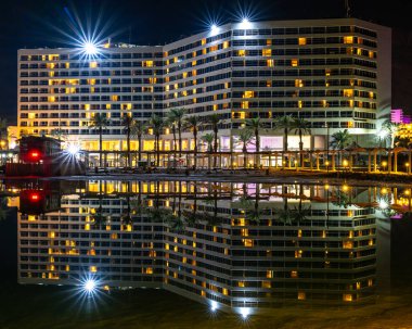 The Dead Sea, Israel December 02, 2024 Night time view of the beautiful  Vert Hotel with reflection in the Dead Sea at Ein Bokek hotel area in israel. clipart