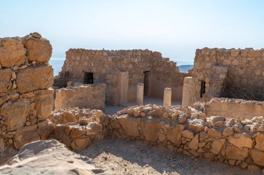 The ruins of the bath house on Masada in the Judean Desert in Israel. clipart