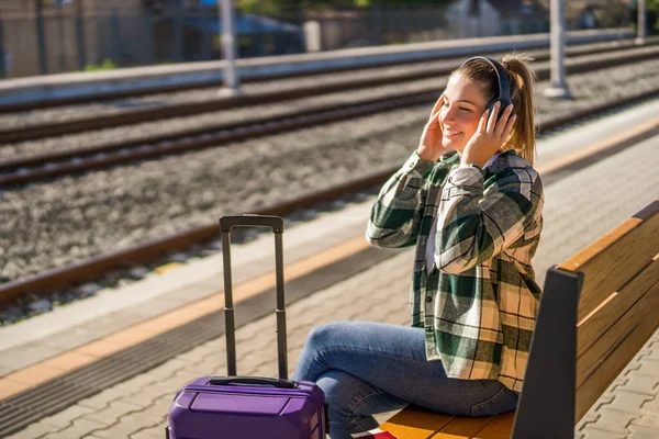 Happy Woman Headphones Enjoys Listening Music While Sitting Bench Train — Stock Photo, Image
