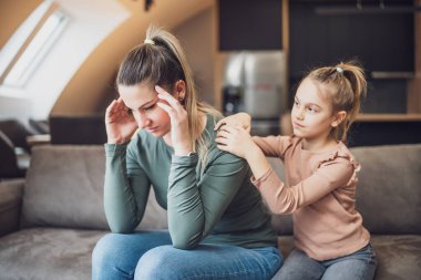 Daughter is trying to comfort  her mother after their conflict.