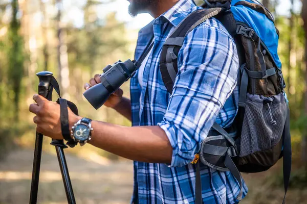 Man Enjoys Using Binoculars Hiking Nature Stockbild