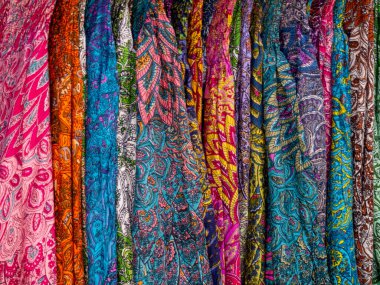 Colorful fabrics for sale on a street n Medina of Marrakesh Morocco
