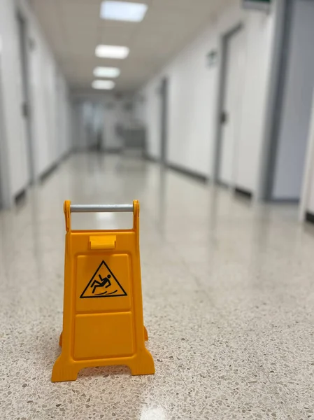 stock image Slippery sign on wet floor in office building