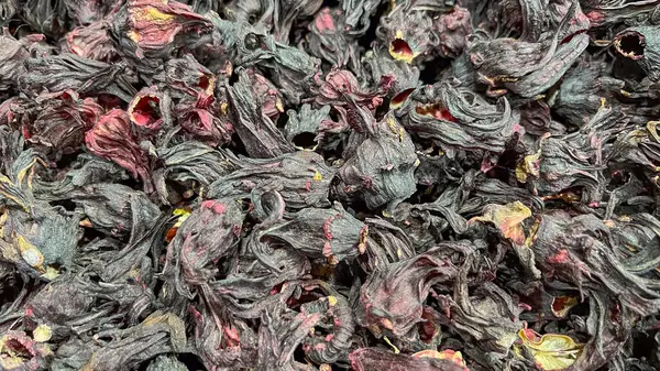 Dried hibiscus flowers in bulk at spice market in Aswan Egypt