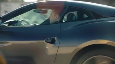 ROME, ITALY - 7 Kasım 2022: lüks gri Ferrari otoyolda hızlanan hız, yüksek hızlı İtalyan araba yarışları tekerlekli logolar, Ferrari hızlı sürüşü. Yüksek kalite
