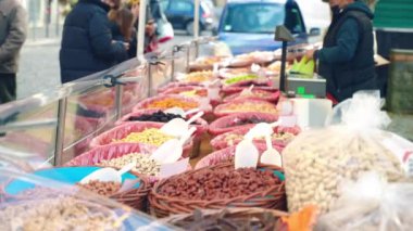 Assortment of dried fruits, nuts, spices and herbs on traditional oriental market, mixture of healthy dried food on bazaar market counter, natural homemade aromatic products, artisan concept. High