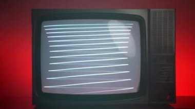 Old vintage TV on red background, blinking horizontal stripes on television screen, bad satellite signal on antique TV, broken television with noise and bars interference on monitor display. High