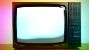 Vintage TV on colourful lights background, blinking screen and horizontal stripes on television display, bad satellite signal on antique TV, broken television with noise and bars interference on