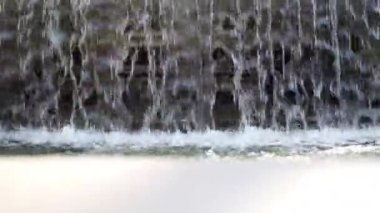 Famous Roman marble fountain with the sculpture of ancient Roman God, low angle view of flowing water, historical place with fountain of ancient times in the downtown of antique powerful Roman Empire