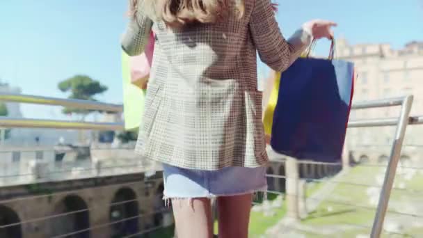 Slim Woman Holding Colourful Shopping Bags Lifting Her Hands Showing — Wideo stockowe