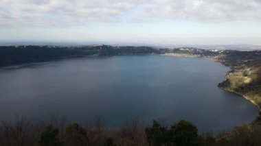 Panoramic view of famous Albano lake from the park terrace on the hill, ancient volcanic crater in the heart of Castelli Romani, tourists famous place and sightseeing concept. High quality 4k footage