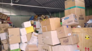 ROME, ITALY - MARCH 10, 2022: Humanitarian aid centre in Rome gathered mountains of boxes and packages with basic necessities for Ukrainian victims of the war like clothes, medicine, food, things for