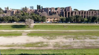 Ruins of antique Italian architecture in the downtown of Rome city, aerial view of archeological place with rich history of powerful Roman Empire. Panorama drone view of ancient part of Rome in the