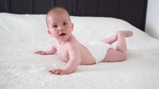 Little Cute Month Old Baby Diaper Lies His Stomach White — Stock Video