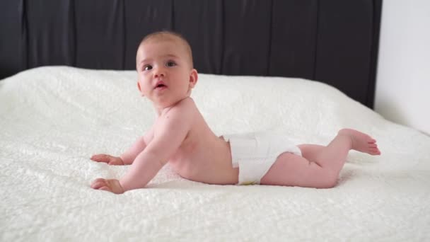 Little Cute Month Old Baby Diaper Lies Stomach Plays Turns — Stock Video