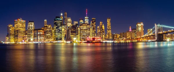 stock image The Manhattan Skyline during Night view with Brooklyn Bridge