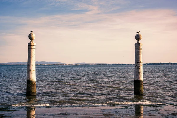 stock image Pier of columns and Tagus River during sunset in Lisbon, Portugal