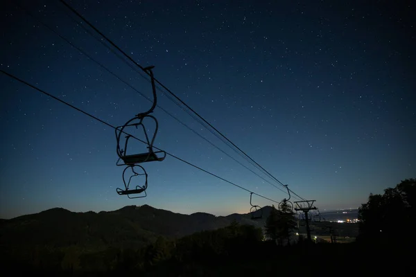 stock image Cable car station at the mountain with starry night sky in Shymbulak ski resort in Almaty, Kazakhstan. High quality photo