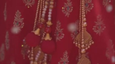 Indian Saree. View from the back of a woman in a red, colorful, sensual, wedding, and very feminine outfit - an Indian sari walks along old streets in India. Traditional national clothing of Indian
