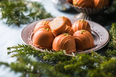 Energy balls for Christmas. Healthy raw vegan dessert (bliss balls), pumpkin vegetarian truffles